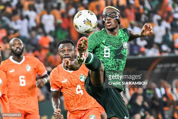 Nigeria's forward Victor Osimhen controls the ball during the Africa Cup of Nations 2024 final football match between Ivory Coast and Nigeria at...