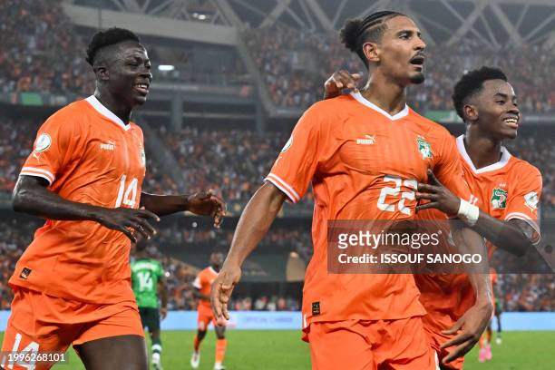 Ivory Coast's forward Sebastien Haller celebrates scoring his team's second goal during the Africa Cup of Nations 2024 final football match between...