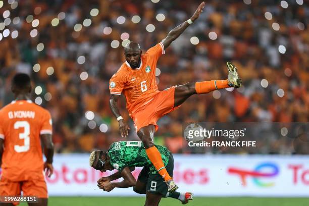 Ivory Coast's midfielder Seko Fofana fights for the ball with Nigeria's forward Victor Osimhen during the Africa Cup of Nations 2024 final football...