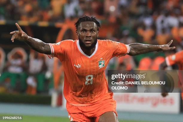 Ivory Coast's midfielder Franck Kessie celebrates scoring his team's first goal during the Africa Cup of Nations 2024 final football match between...
