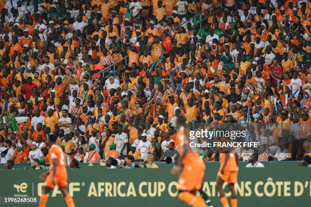 Ivorian supporters wave during the Africa Cup of Nations 2024 final football match between Ivory Coast and Nigeria at Alassane Ouattara Olympic...