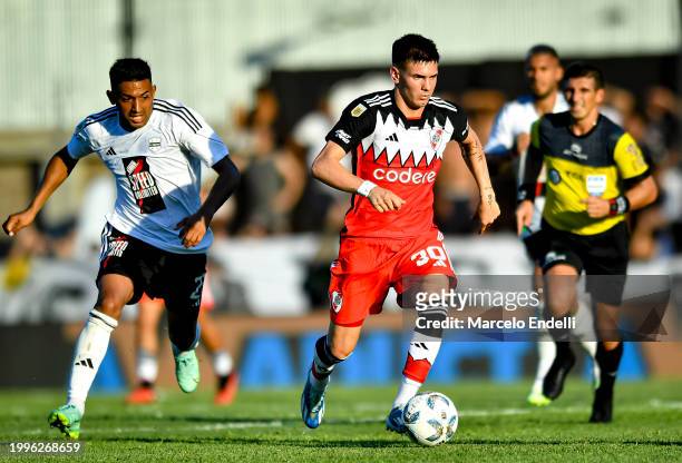 Franco Mastantuono of River Plate drives the ball during a Copa de la Liga 2024 group A match between Deportivo Riestra and River Plate at Estadio...