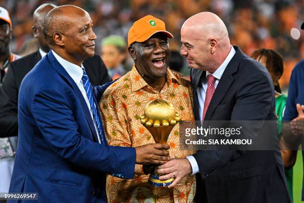 President of the Confederation of African Football Patrice Motsepe , President of Ivory Coast Alassane Ouattara and President of FIFA Gianni...