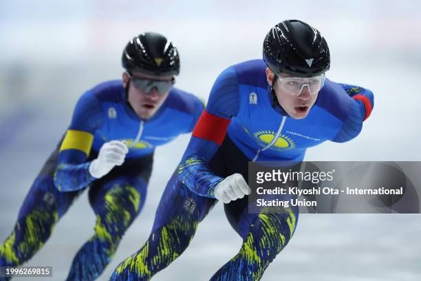 Mikhail Gluchshenko and Andrey Semenov of Kazakhstan compete in the Team Sprint Men race on day three of the ISU World Junior Speed Skating...