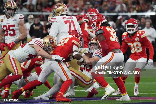 San Francisco 49ers' quarterback Brock Purdy is tackled during Super Bowl LVIII between the Kansas City Chiefs and the San Francisco 49ers at...