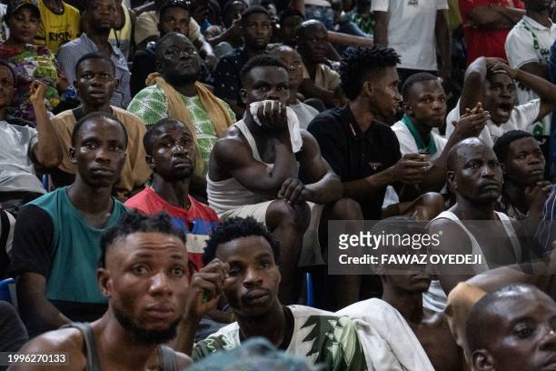 Nigeria supporters react after Ivory Coast won as they watch the Africa Cup of Nations 2024 final football match between Ivory Coast and Nigeria that...