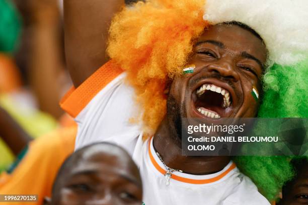 An Ivory Coast supporter gestures after Ivory Coast won the Africa Cup of Nations 2024 final football match between Ivory Coast and Nigeria at...
