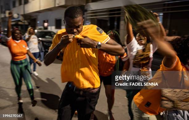 Ivorian supporters celebrate the victory of the Ivory Cost football team in the Moroccan capital of Rabat on February 11, 2024 after the Africa Cup...