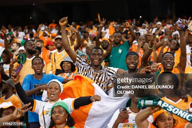 Ivory Coast supporters celebrate after their team won the Africa Cup of Nations 2024 final football match between Ivory Coast and Nigeria at Alassane...