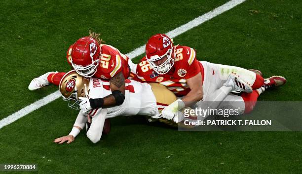 Kansas City Chiefs' safety Justin Reid tackles San Francisco 49ers' quarterback Brock Purdy during Super Bowl LVIII between the Kansas City Chiefs...