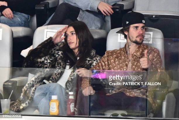 Canadian singer-songwriter Justin Bieber and his wife US model Hailey Bieber watch Super Bowl LVIII between the Kansas City Chiefs and the San...