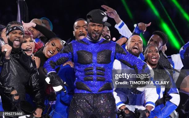 Singer-songwriter Usher performs during Apple Music halftime show of Super Bowl LVIII between the Kansas City Chiefs and the San Francisco 49ers at...