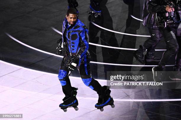 Singer-songwriter Usher performs during Apple Music halftime show of Super Bowl LVIII between the Kansas City Chiefs and the San Francisco 49ers at...