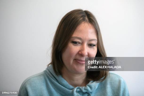 Maryna Troshchenko from southern Ukraine poses for a photo in the apartment she shares with her daughter and mother in Vienna, Austria on February 8,...