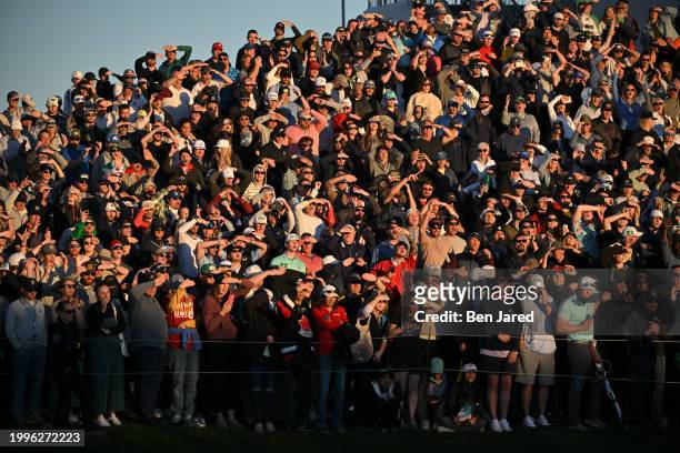 Fans watch play near the 18th green during the final round of WM Phoenix Open at TPC Scottsdale on February 11, 2024 in Scottsdale, Arizona.