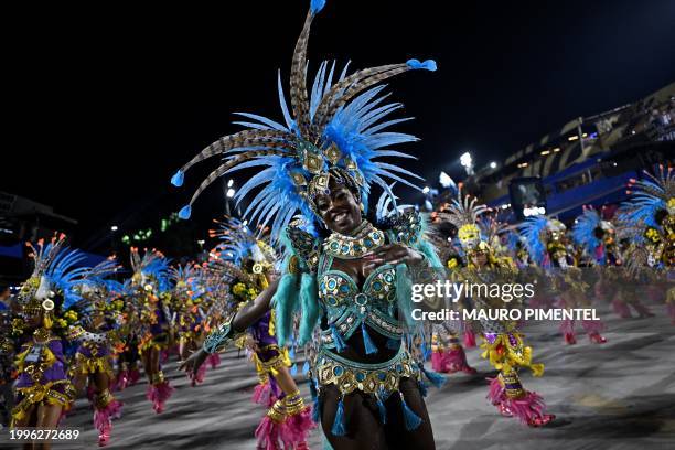 Members of the Beija-Flor samba school perform during the first night of the Carnival parade at the Marques de Sapucai Sambadrome in Rio de Janeiro...