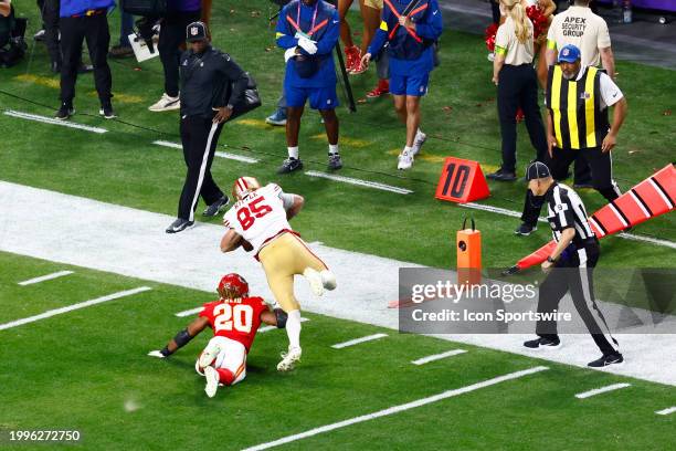 San Francisco 49ers tight end George Kittle catches a pass and stretches for the first down at the end of his run in the third quarter during Super...