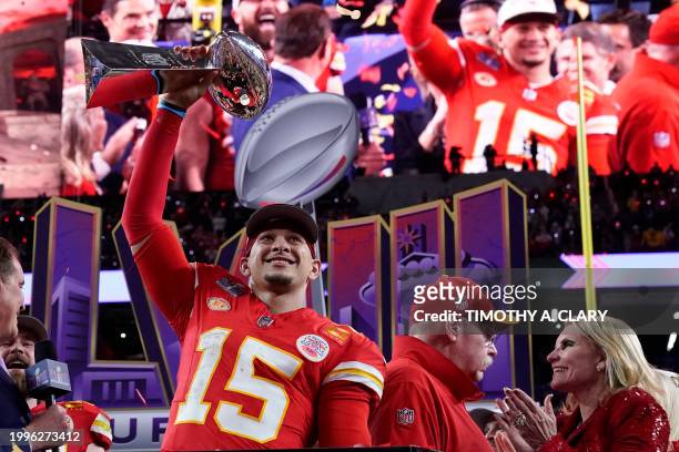Kansas City Chiefs' quarterback Patrick Mahomes celebrates with the trophy after the Chiefs won Super Bowl LVIII against the San Francisco 49ers at...