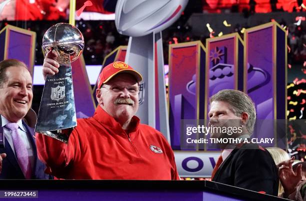 Kansas City Chiefs' head coach Andy Reid holds the trophy next to Kansas City Chiefs' owner, chairman and CEO Clark Hunt as they celebrate winning...