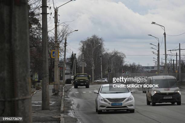 Cars drive on a road in Kharkiv, on February 8 amid the Russian invasion of Ukraine.