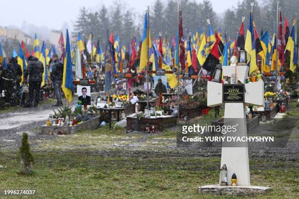 This photograph taken on February 8 shows the graves of Ukrainian soldiers at Lychakiv cemetery in the western Ukrainian city of Lviv, amid the...