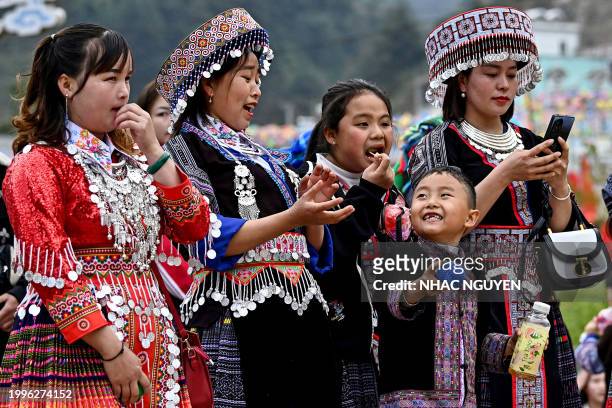 Ethnic Hmong people wearing traditional outfit play "pao toss" on the occasion of Vietnamese Lunar New Year or Tet, in northern Vietnam's Yen Bai...