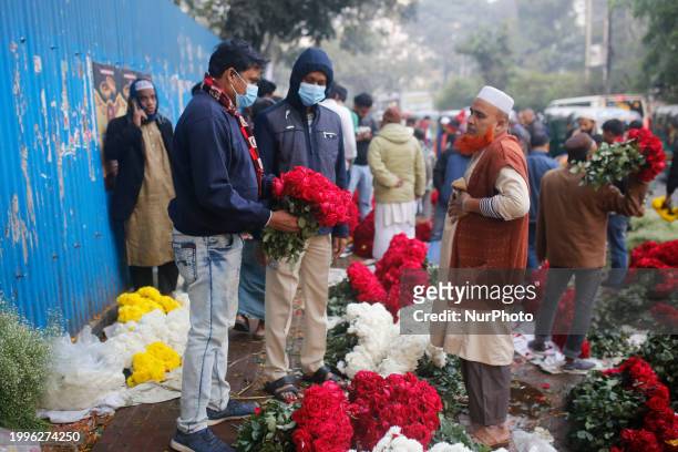Vendors are selling flowers at a wholesale flower market ahead of Valentine's Day in Dhaka, Bangladesh, on February 12, 2024.