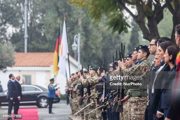 Nikos Christodoulides and Frank-Walter Steinmeier are standing for the national anthems of their respective countries in Nicosia, Cyprus, on February...