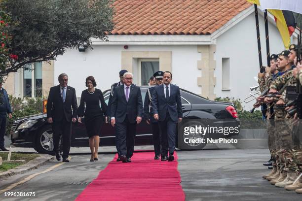Nikos Christodoulides and Frank-Walter Steinmeier are walking in front of the soldiers in Nicosia, Cyprus, on February 12, 2024. The President of...