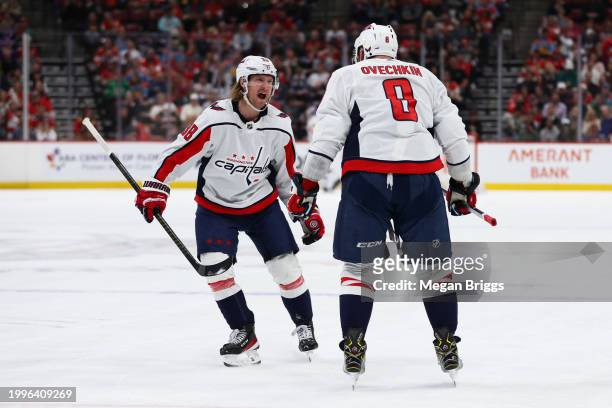 Alex Ovechkin of the Washington Capitals celebrates with teammate Rasmus Sandin after scoring a goal against the Florida Panthers during the first...