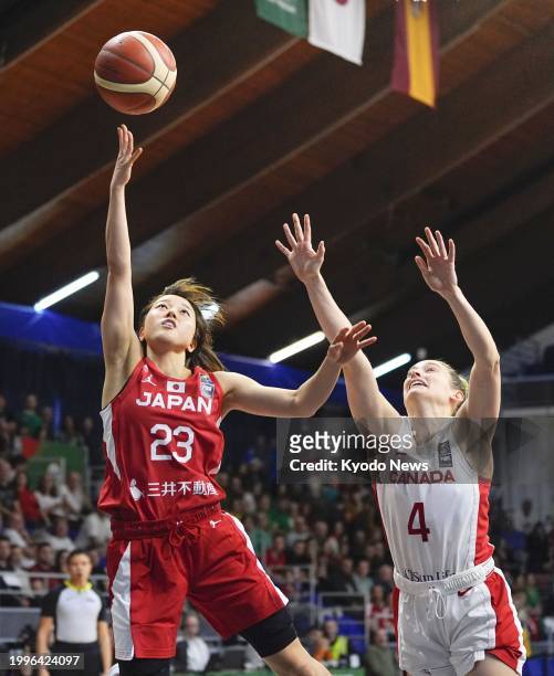 Japan's Mai Yamamoto scores during the third quarter of an Olympic women's basketball qualifier against Canada on Feb. 11 in Sopron, Hungary.