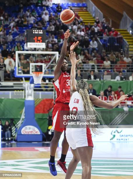 Japan's Evelyn Mawuli scores a three-pointer during the second quarter of an Olympic women's basketball qualifier against Canada on Feb. 11 in...