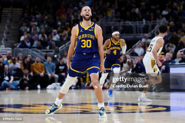 Stephen Curry of the Golden State Warriors celebrates after making a shot in the first quarter against the Indiana Pacers at Gainbridge Fieldhouse on...