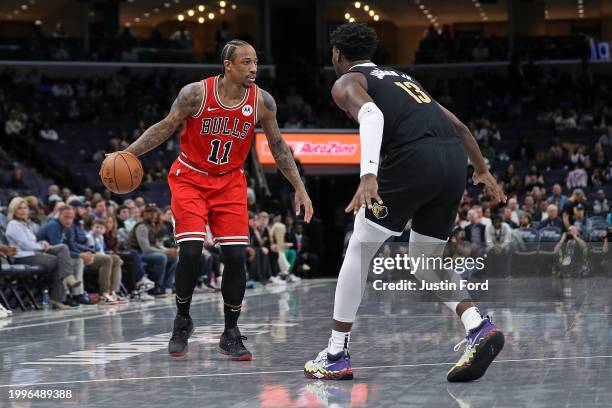 DeMar DeRozan of the Chicago Bulls handles the ball against Jaren Jackson Jr. #13 of the Memphis Grizzlies during the first half at FedExForum on...