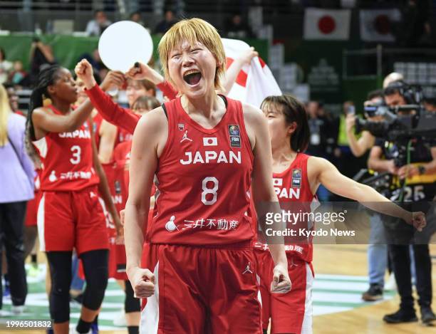 Japan's Maki Takada celebrates after her team secured a spot in the 2024 Paris Olympic women's basketball tournament by defeating Canada in a...
