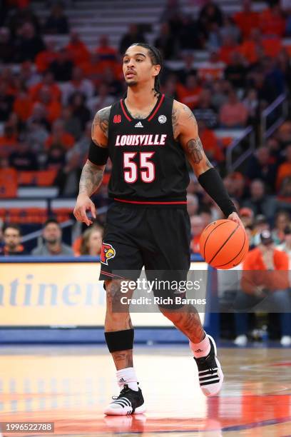 Skyy Clark of the Louisville Cardinals controls the ball against the Syracuse Orange during the first half at the JMA Wireless Dome on February 7,...