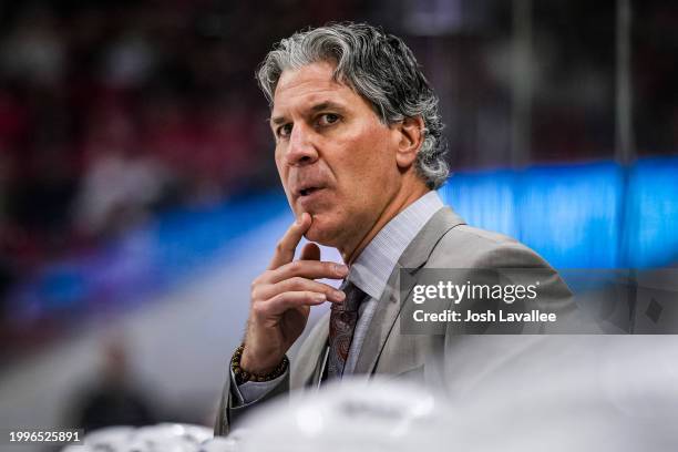 Head coach Jared Bednar of the Colorado Avalanche looks on during the second period against the Carolina Hurricanes at PNC Arena on February 08, 2024...