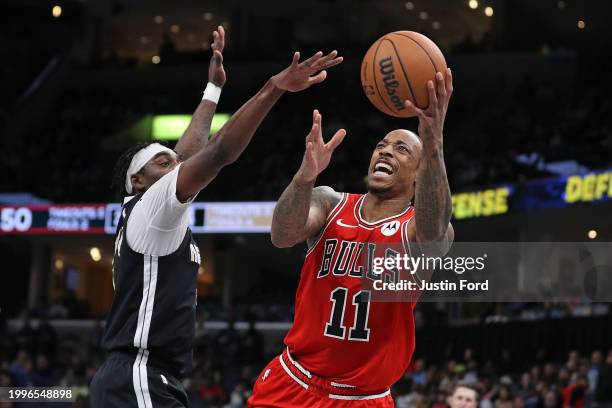 DeMar DeRozan of the Chicago Bulls goes to the basket against Vince Williams Jr. #5 of the Memphis Grizzlies \d1h at FedExForum on February 08, 2024...