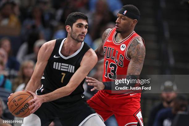 Santi Aldama of the Memphis Grizzlies handles the ball against Torrey Craig of the Chicago Bulls during the first half at FedExForum on February 08,...