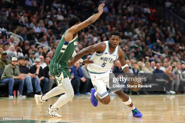 Anthony Edwards of the Minnesota Timberwolves drives to the basket against Malik Beasley of the Milwaukee Bucks during the first half of a game at...