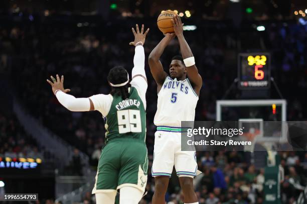Anthony Edwards of the Minnesota Timberwolves shoots over Jae Crowder of the Milwaukee Bucks during the first half of a game at Fiserv Forum on...