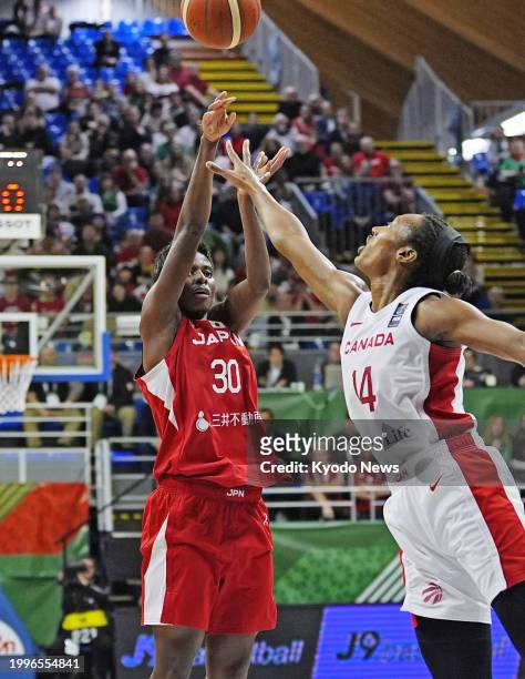 Japan's Evelyn Mawuli attempts a shot during the second quarter of an Olympic women's basketball qualifier against Canada on Feb. 11 in Sopron,...