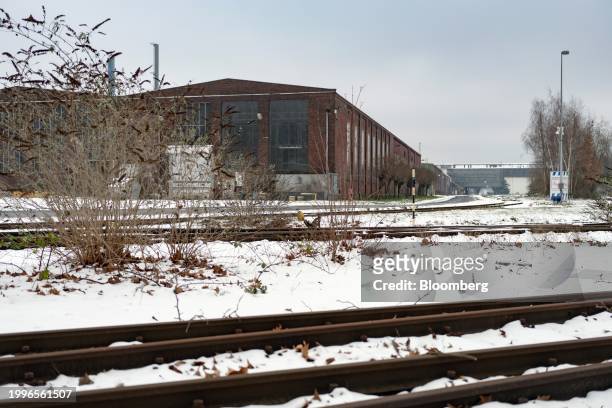Rail lines lead to production facilities and old equipment in a yard at the closed Vallourec SACA pipe plant in Düsseldorf, Germany, on Friday, Jan....