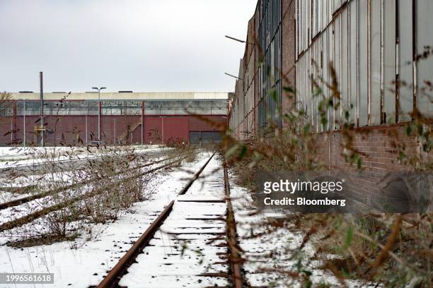 Rail lines lead to production facilities and old equipment in a yard at the closed Vallourec SACA pipe plant in Düsseldorf, Germany, on Friday, Jan....