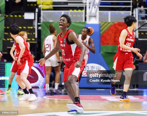 Japan's Evelyn Mawuli reacts after scoring a three-pointer during the fourth quarter of an Olympic women's basketball qualifier against Canada on...