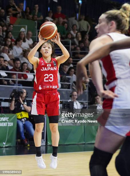 Japan's Mai Yamamoto scores a three-pointer during the third quarter of an Olympic women's basketball qualifier against Canada on Feb. 11 in Sopron,...