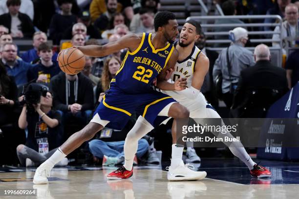Andrew Wiggins of the Golden State Warriors posts up against Tyrese Haliburton of the Indiana Pacers in the second quarter at Gainbridge Fieldhouse...