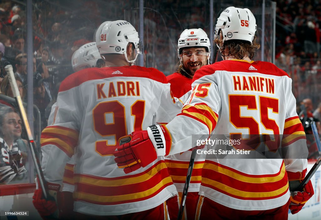The Calgary Flames celebrate a goal scored by Andrei Kuzmenko