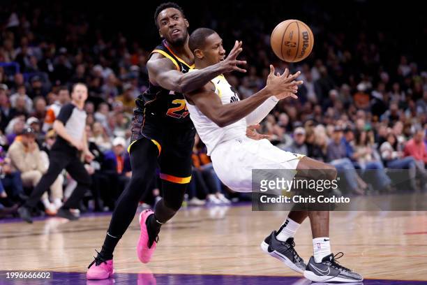 Kris Dunn of the Utah Jazz and Nassir Little of the Phoenix Suns battle for a loose ball during the first half at Footprint Center on February 08,...