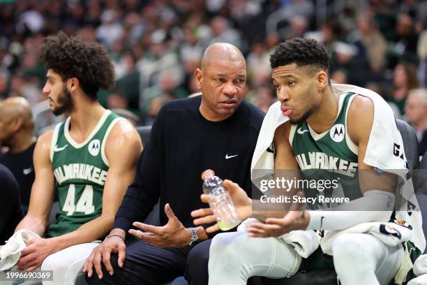 Head coach Doc Rivers of the Milwaukee Bucks speaks with Giannis Antetokounmpo during the second half of a game against the Minnesota Timberwolves at...